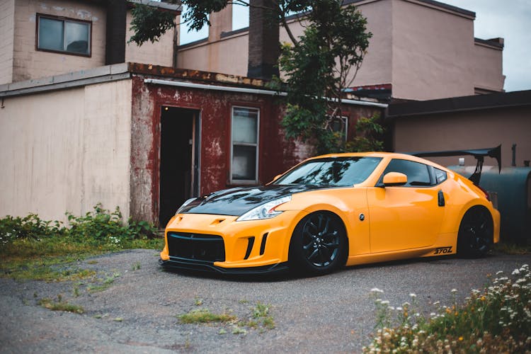 Nissan 350Z Near Tree And Building