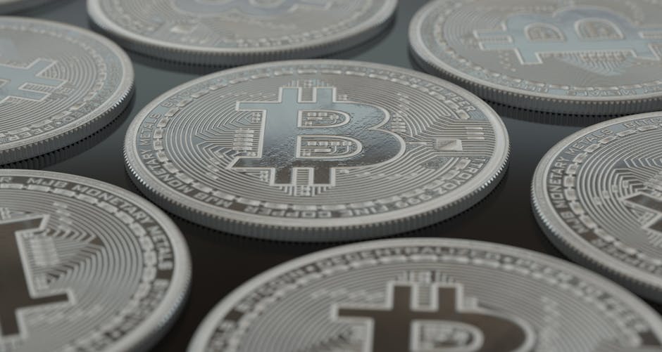 Detailed close-up of silver Bitcoin coins showcasing digital currency concepts.