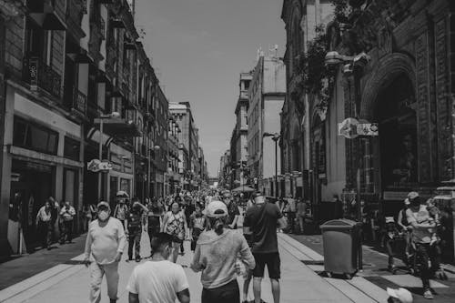 Grayscale Photo of People Walking on Street