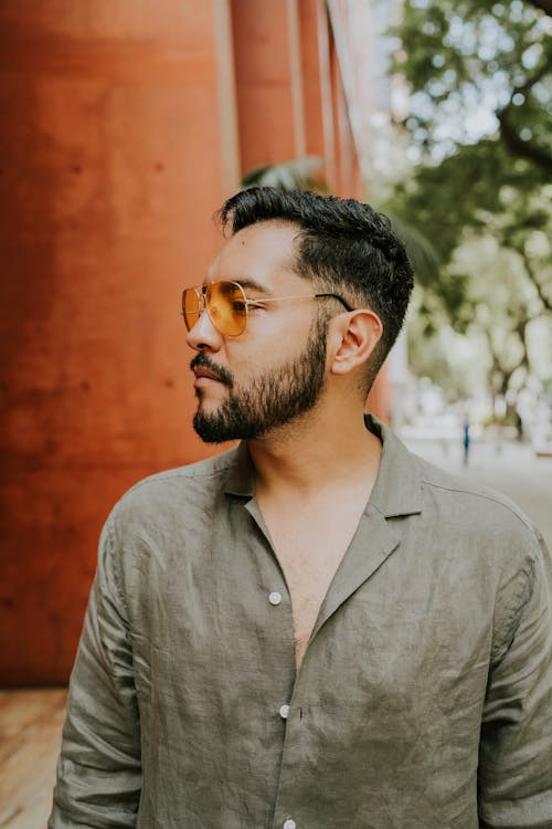 Bearded Man in Button Down Shirt Looking Away