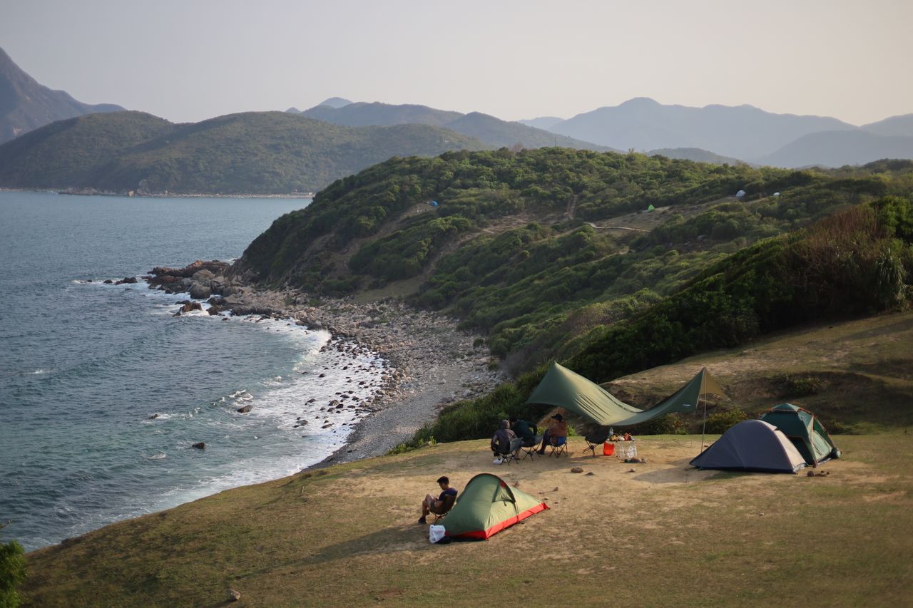 aerial view of tents and campers on the scenic hong kong coastline
