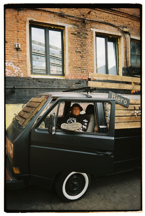 Man Sitting in Abandoned Van