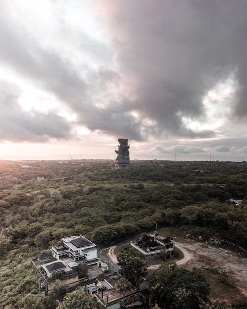 Building behind Forest under Clouds