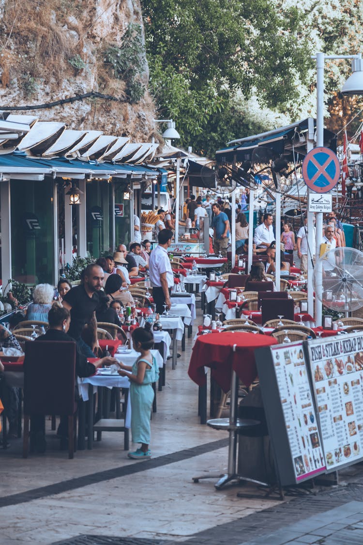 People Sitting At An Al Fresco Dining Area