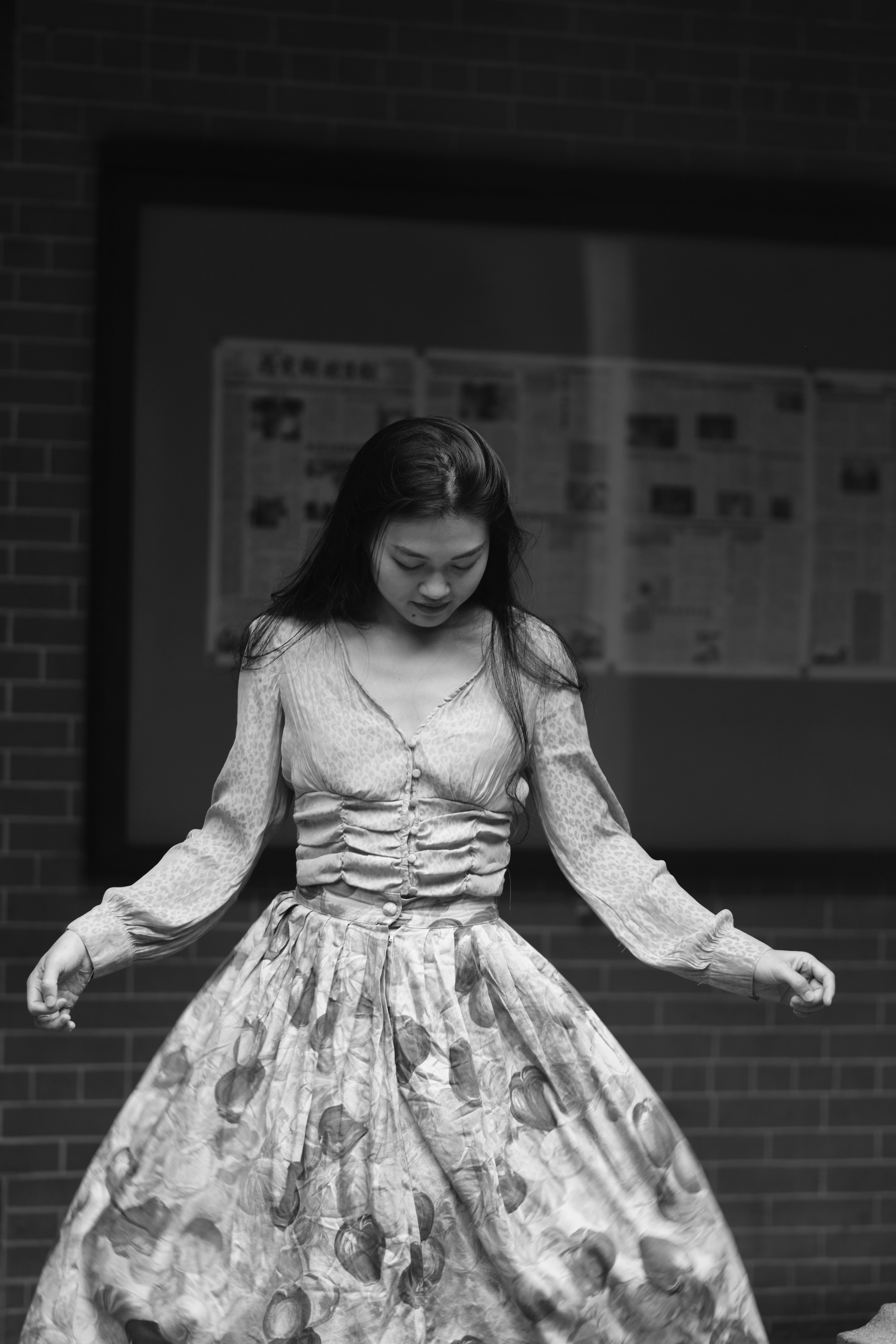 Grayscale Photo of a Woman in Floral Dress · Free Stock Photo