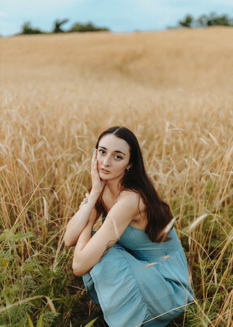 Portrait Of Woman Posing In Summer Field