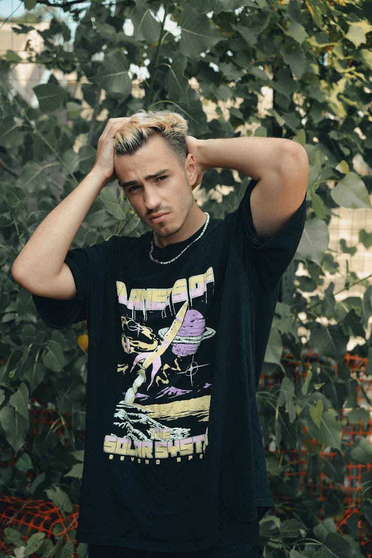 Portrait Of Young Man In Black T-shirt In Park