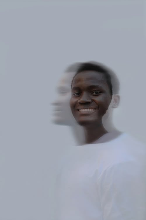 Smiling Man in White Crew Neck T-Shirt