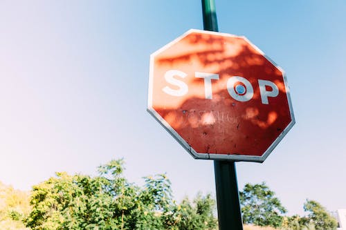 Free Red Stop Signage Under Clear Blue Sky Stock Photo