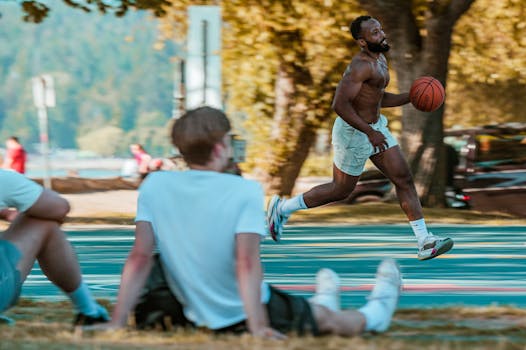 Energetic basketball match in a public park in Vancouver, BC with players in action.