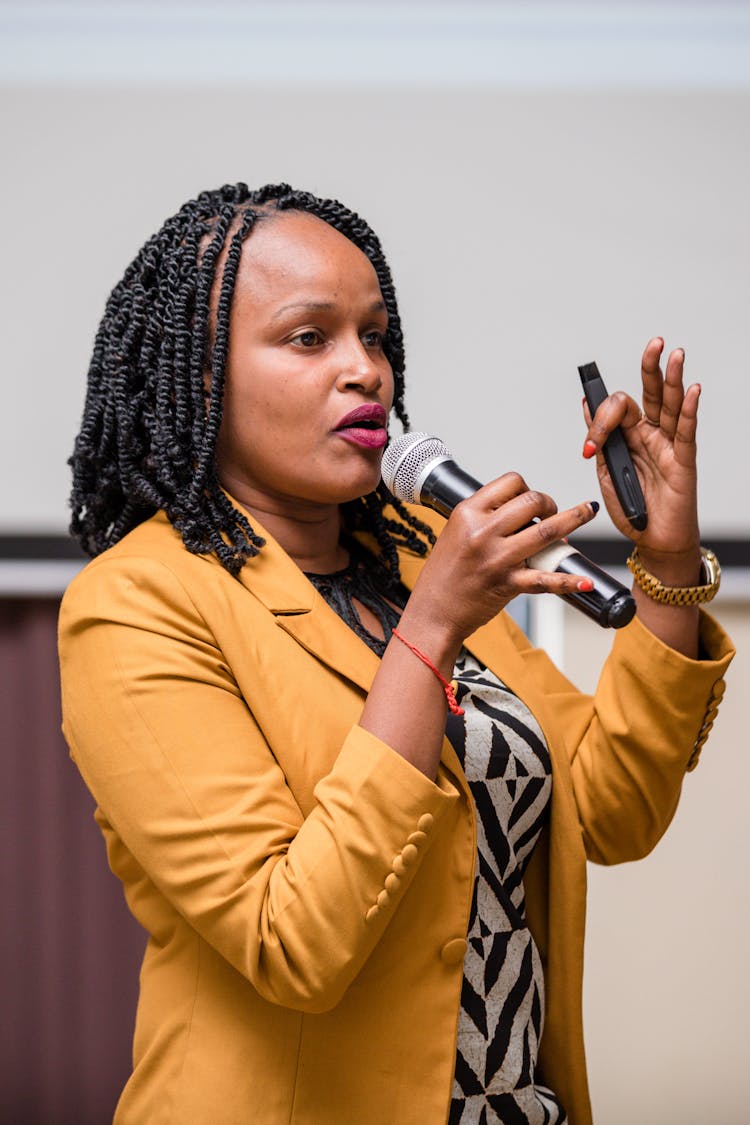 Woman Speaking With Microphone