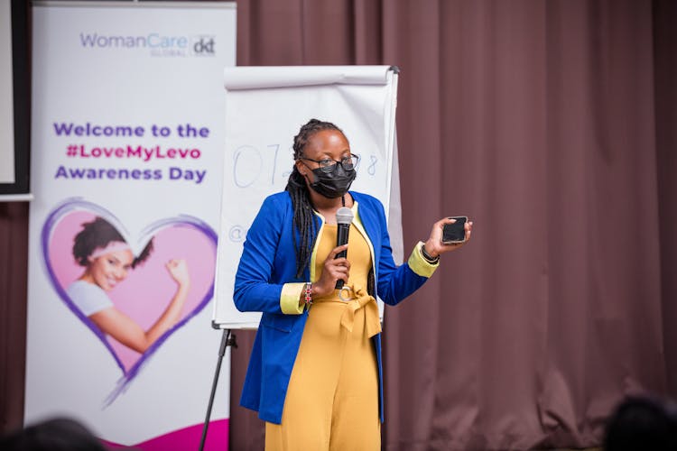 Woman In Mask Presenting