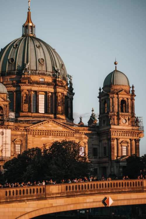 Free Detailed view of a historic cathedral with domes at sunset, featuring intricate architecture. Stock Photo