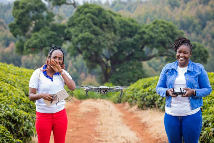 Smiling Women Controlling Drone