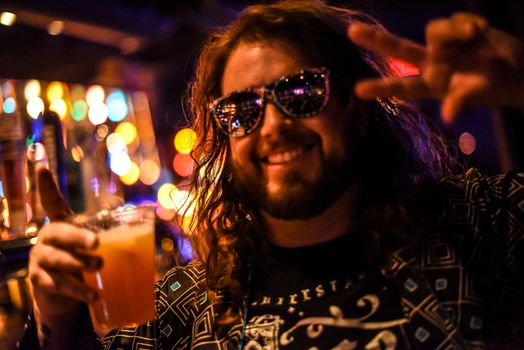 Man in Black and White Crew Neck Shirt Wearing Black Sunglasses