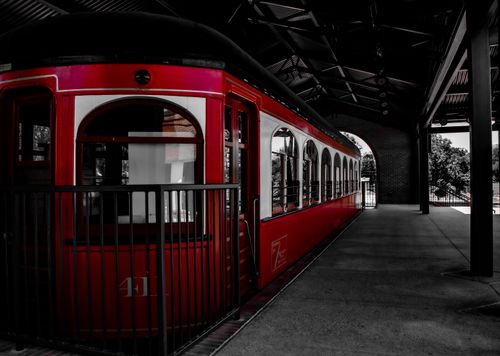 Free A classic red train car at a vintage railway station, exuding retro charm. Stock Photo