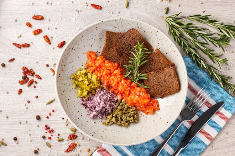 Top View Of Chopped Vegetables And Slices Of Bread On A Plate