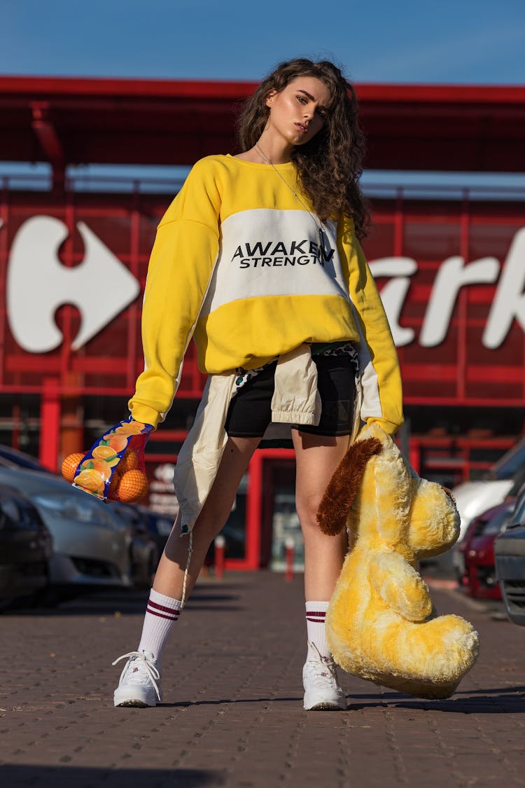 Model Posing In Sportswear In Front Of Supermarket