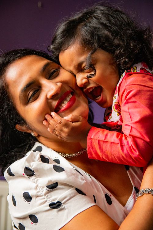Free Happy mother and son sharing a loving hug in a warm, indoor setting. Stock Photo
