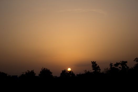 Captivating sunset silhouette in Bursa, Türkiye, offering a tranquil view of the horizon with copy space.