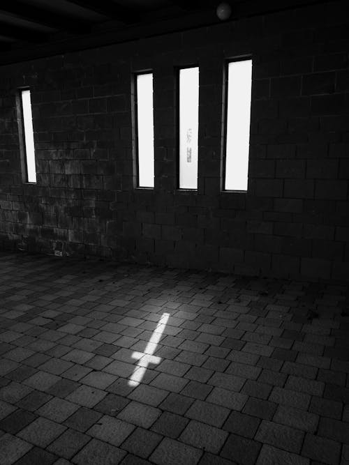 Cross Shaped Sunlight in Shadowed Interior