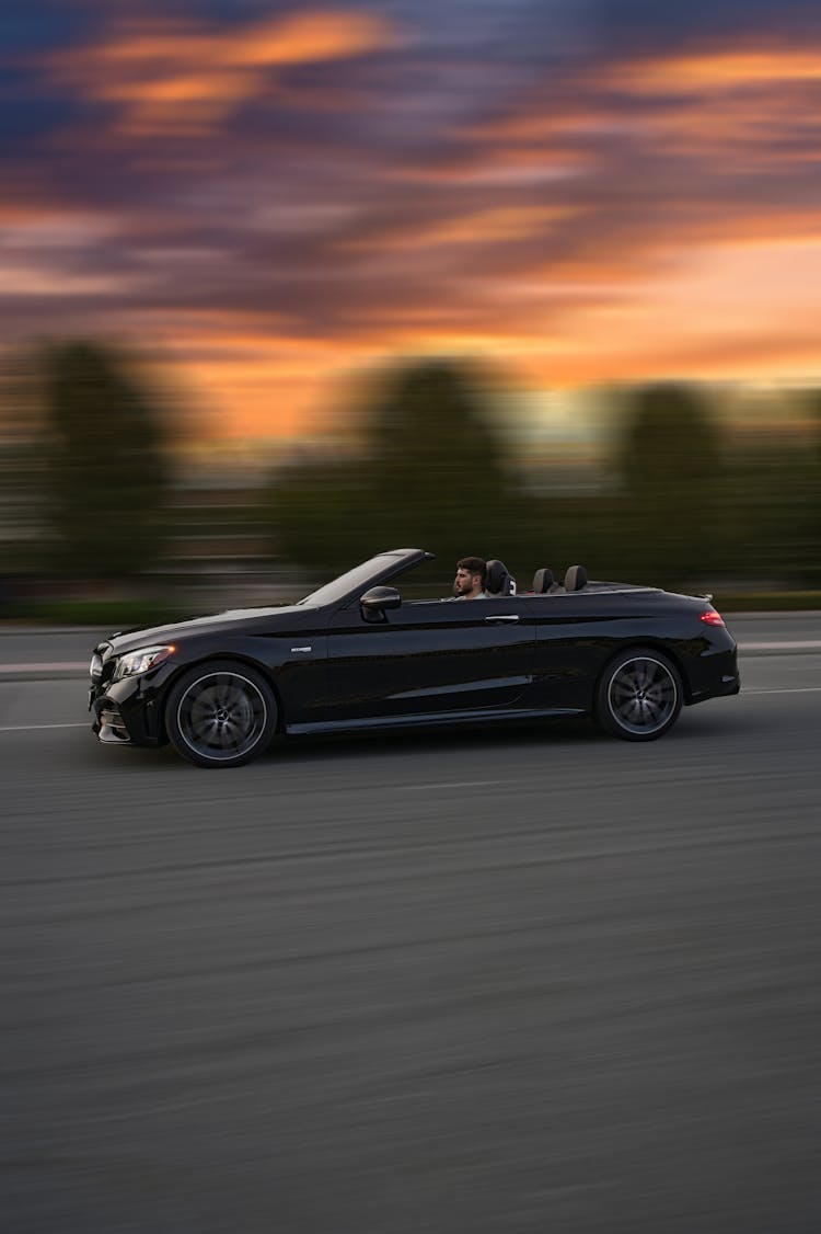 Black Convertible Car On The Road