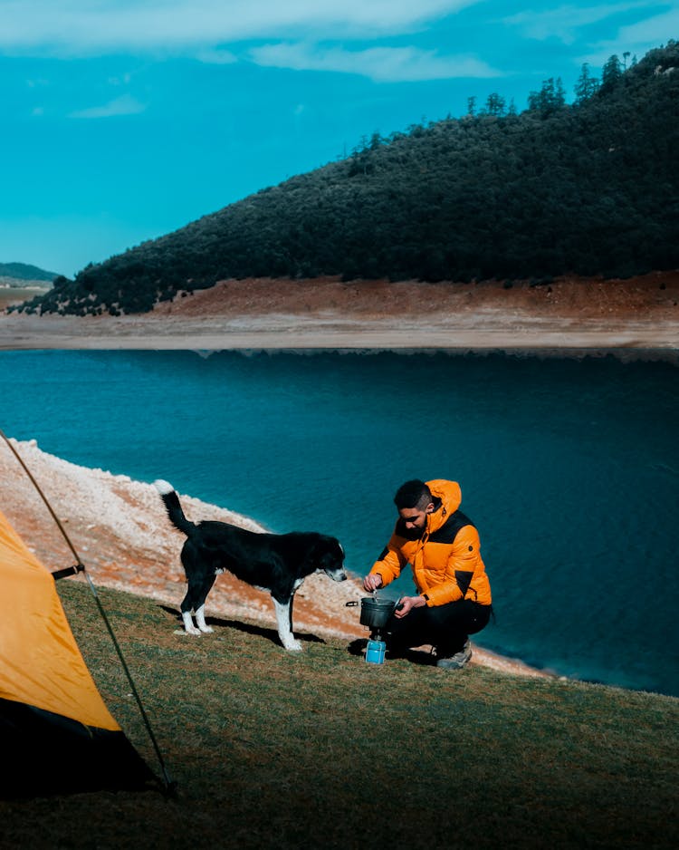 Man Camping With His Dog