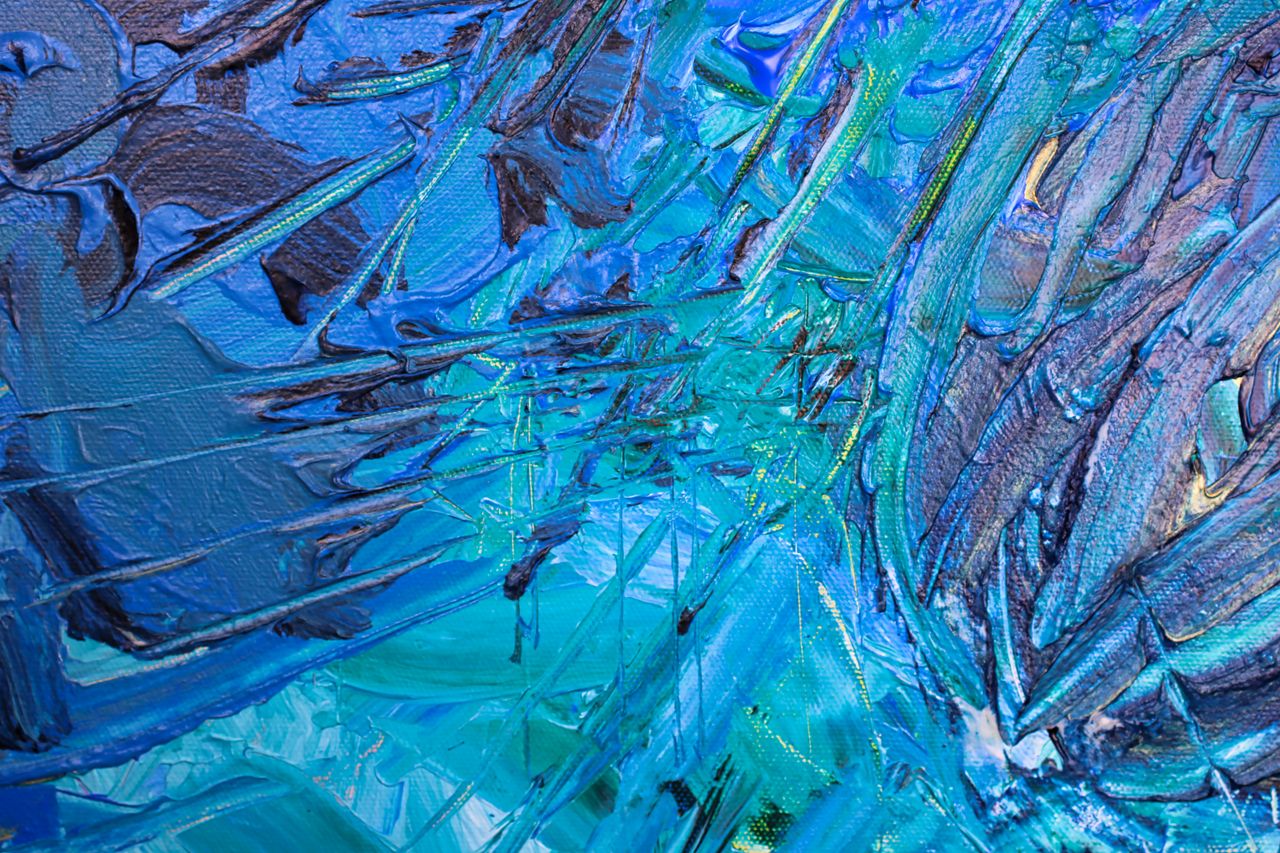 dynamic abstract art with textured blue strokes creating a vivid visua