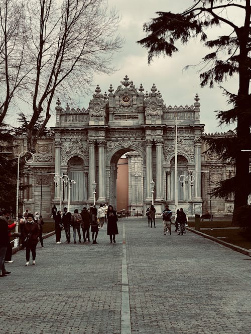 Free People Walking on Street in front of Dolmabahçe Palace Stock Photo