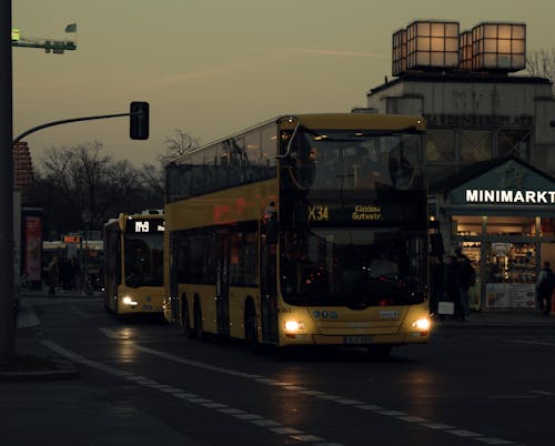 Yellow Double Decker Bus on the Road