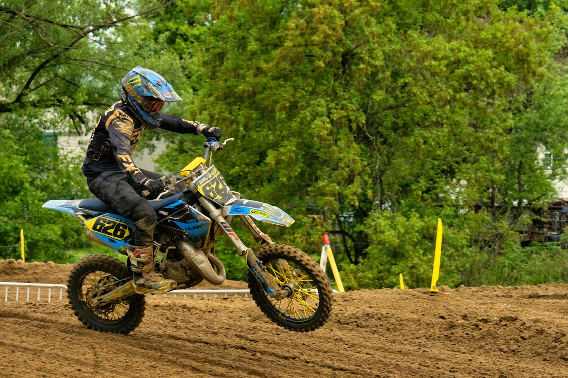 A Person Riding a Motorcycle on a Dirt Road