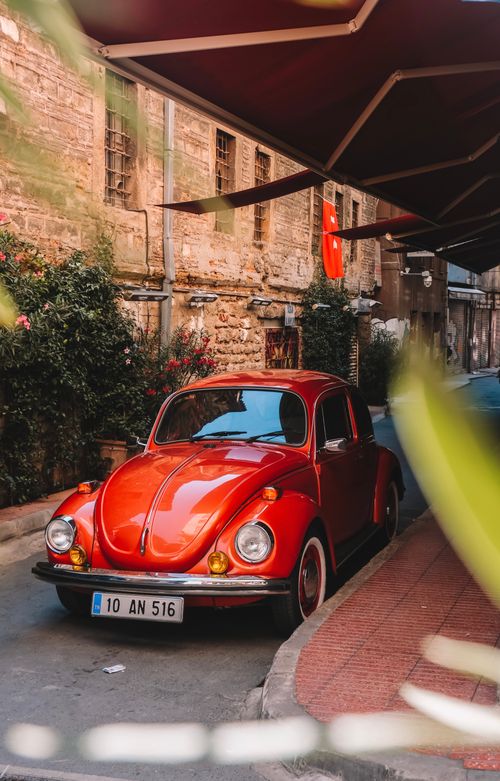 Free Classic red Volkswagen Beetle parked on a historic street in Istanbul, Turkey. Stock Photo