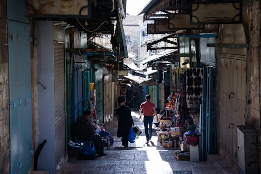 A bustling alley filled with shops in the Old City of Jerusalem, Israel.