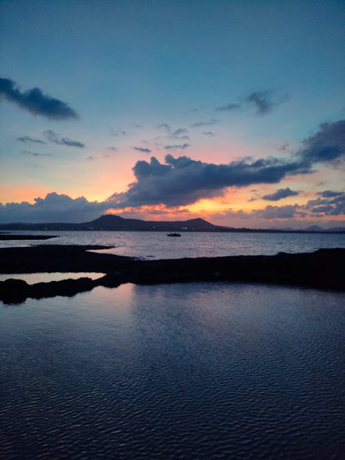 Photos gratuites de bord de mer, ciel spectaculaire, coucher de soleil