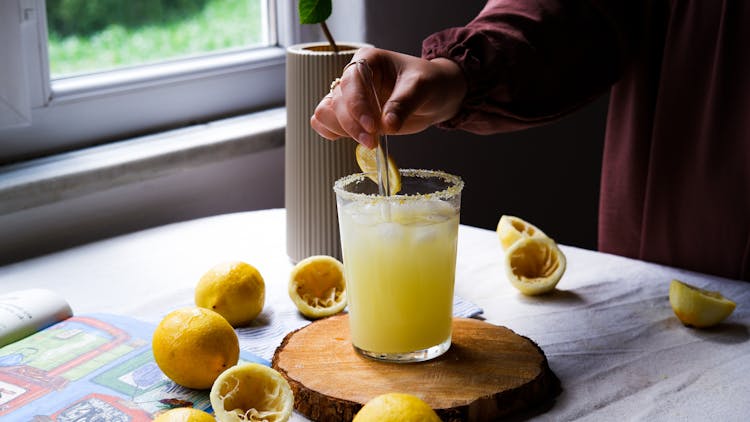 A Yellow Liquid On A Drinking Glass