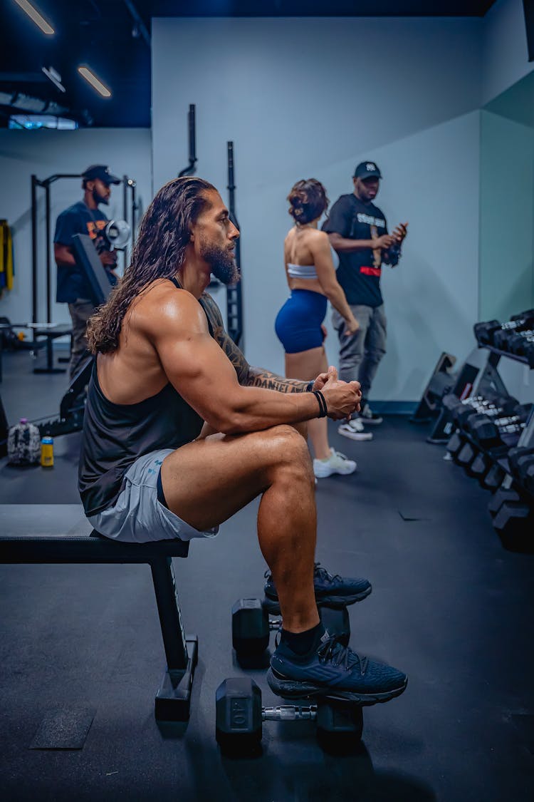 Muscular Man Training In Gym