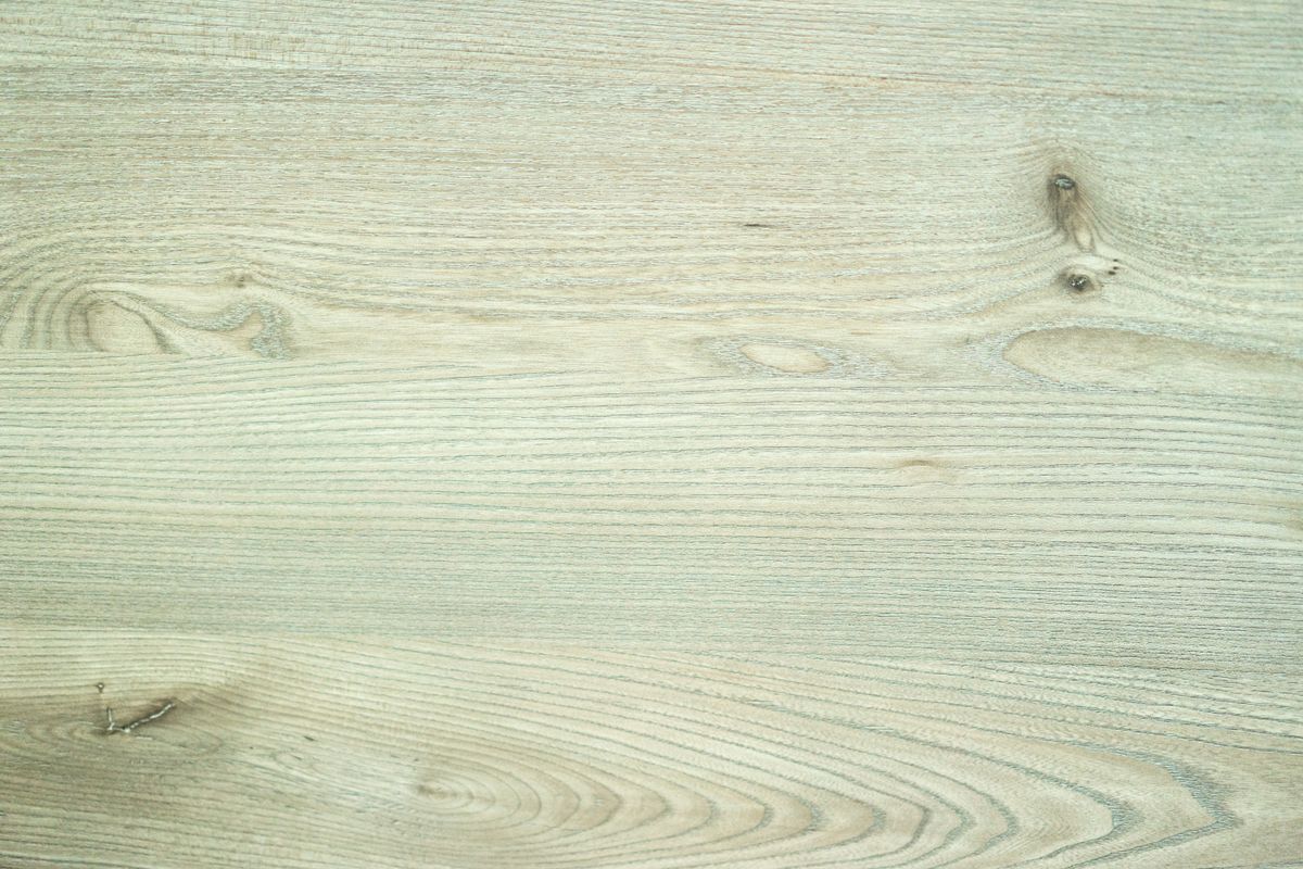 Solid vs. Engineered Hardwood Flooring: 2026 Guide 8 Close-up of authentic hardwood grain with natural knots