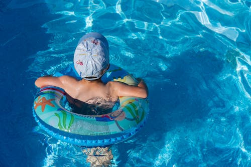 Boy Wearing Cap in a Swimming Pool
