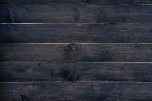 Free Rustic dark wooden planks create a natural textured background for design projects. Stock Photo