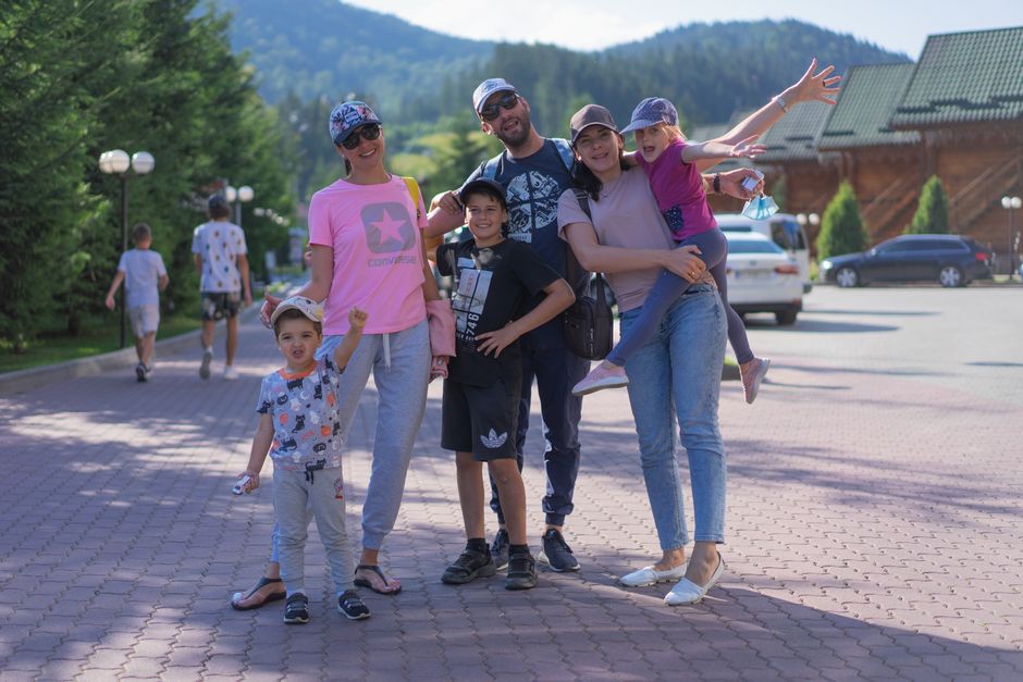 Photo by Atlantic Ambience on Pexels A joyful family of six spending quality time together in a scenic outdoor setting with mountains in the background. - Photo by Atlantic Ambience on Pexels