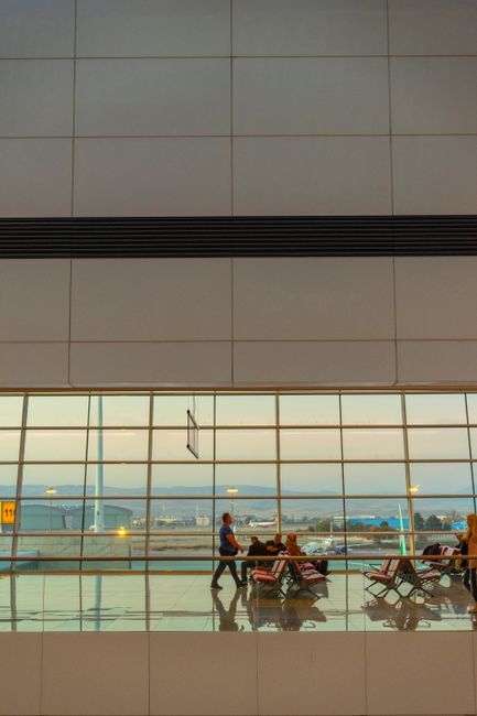 Busy airport terminal with travelers