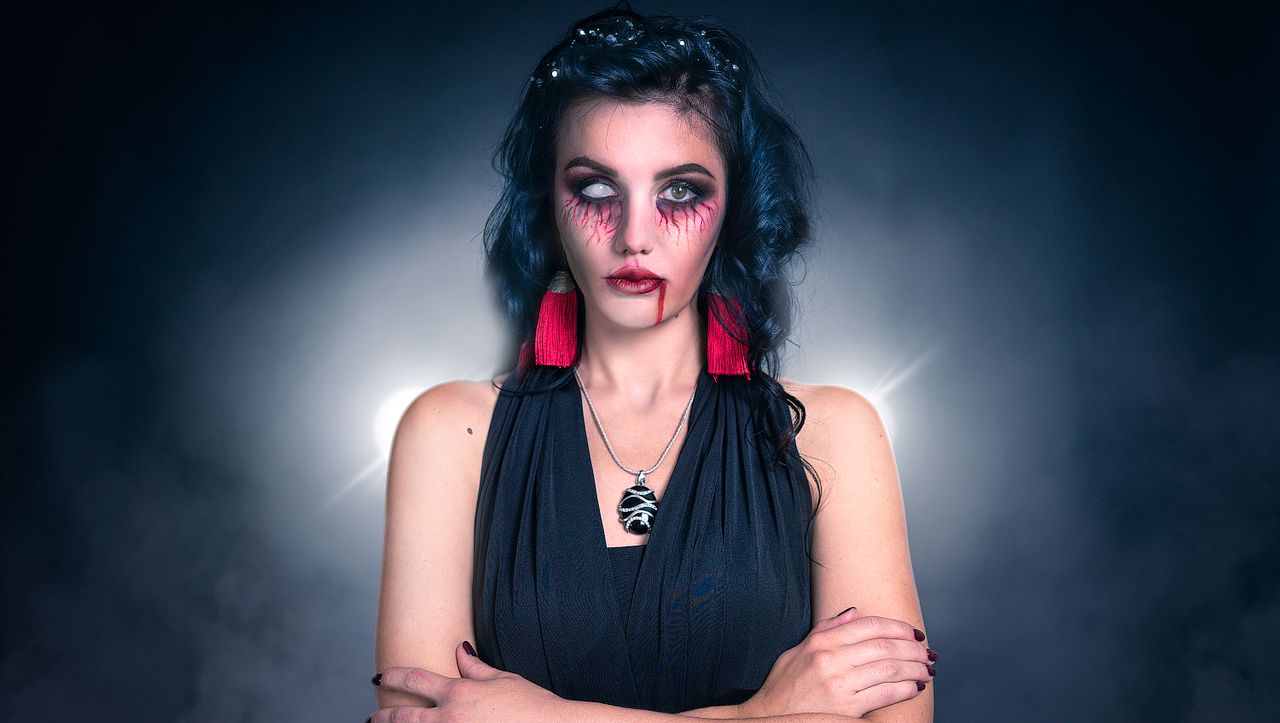 close up of a woman s spooky halloween look featuring creepy makeup an