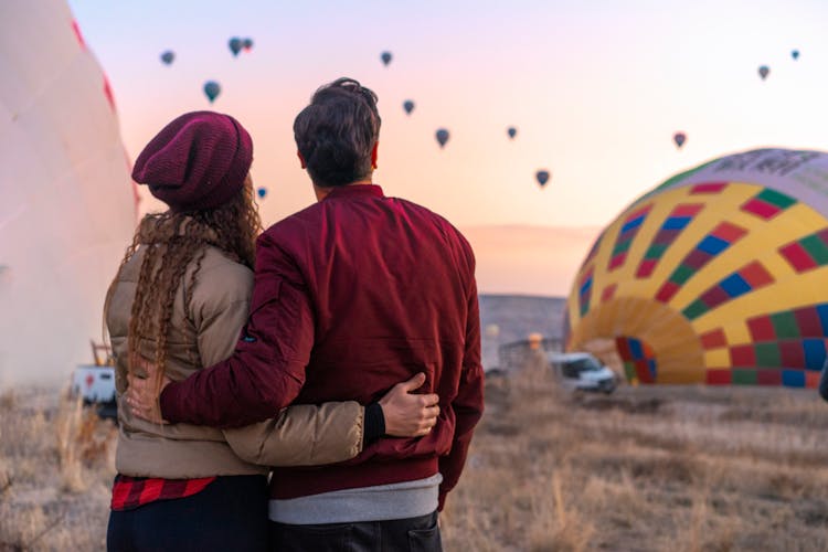 Couple Watching Hot Air Balloons Together