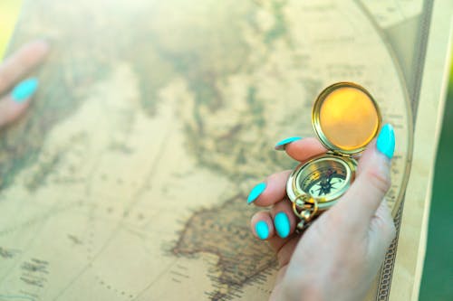 Person Holding a Vintage Compass