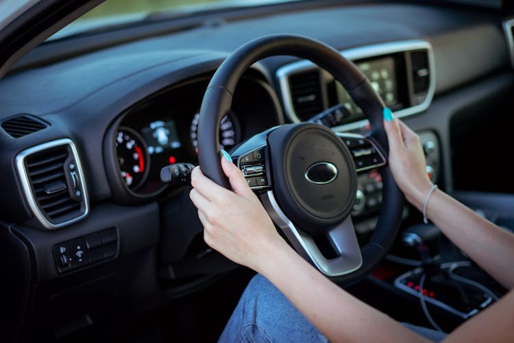 Woman Hands Holding Steering Wheel