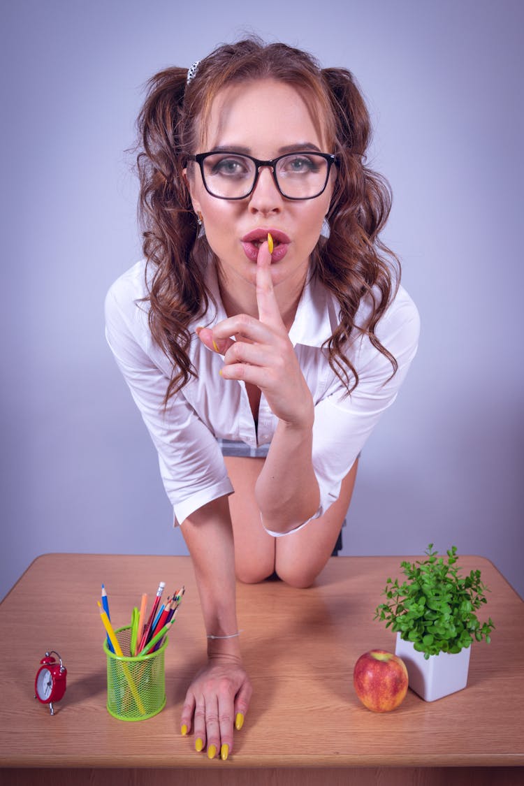 Seductive Woman Kneeling On Desk