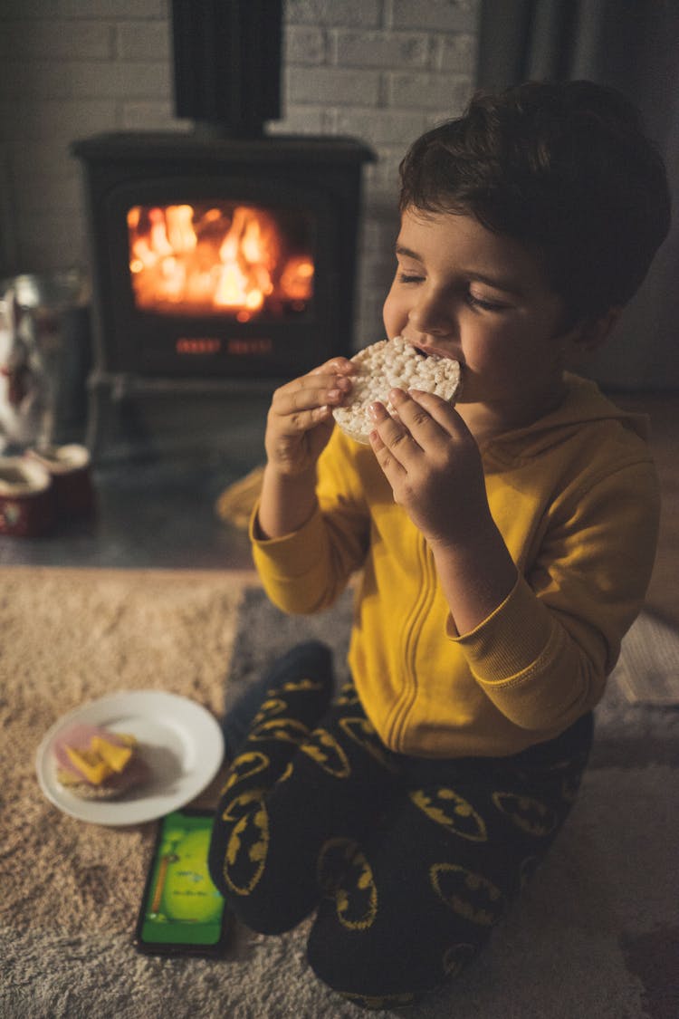 Close-up Of A Boy Eating Sandwich