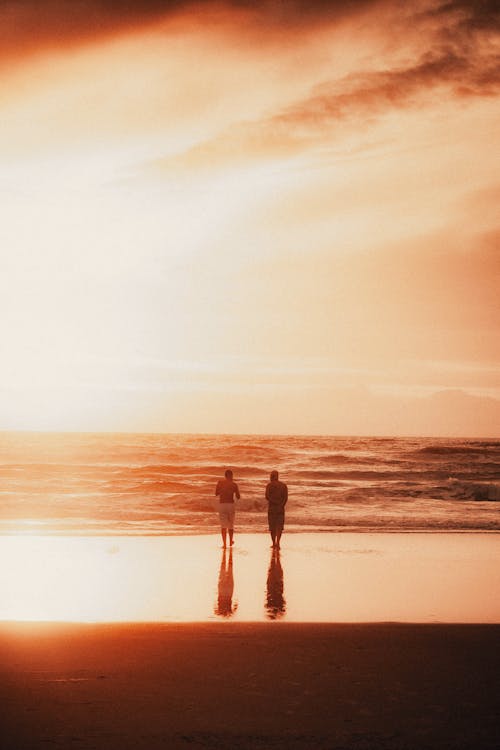 Men on Beach at Sunset