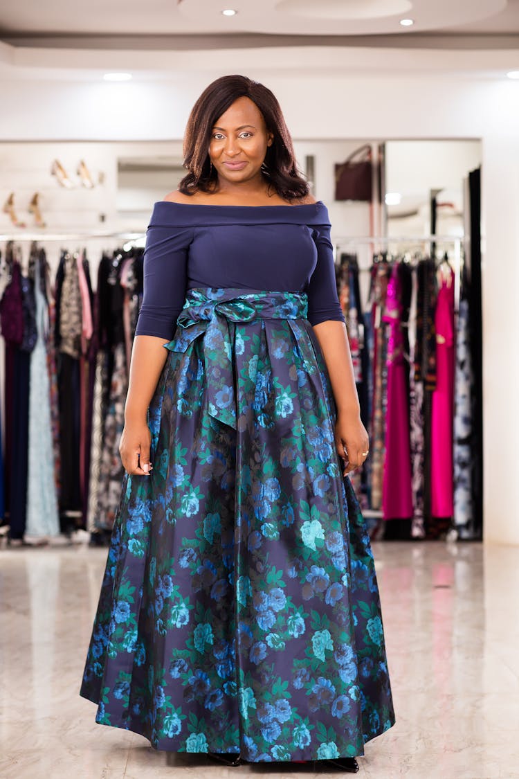 Woman Wearing A Blue Dress With Floral Pattern 