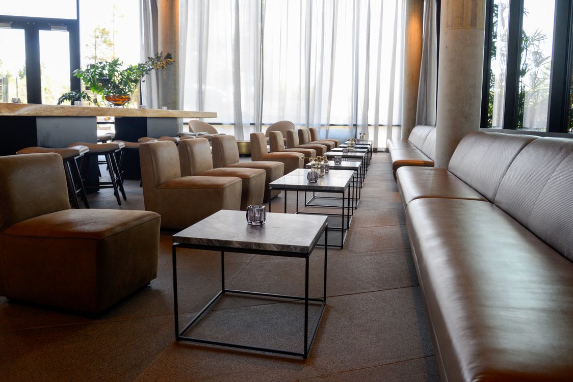 Bar Interior with Leather Couches and Square Coffee Tables · Free Stock ...